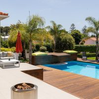 Beautiful backyard with a pool and lounge area.
