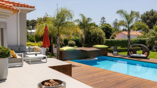 Beautiful backyard with a pool and lounge area.
